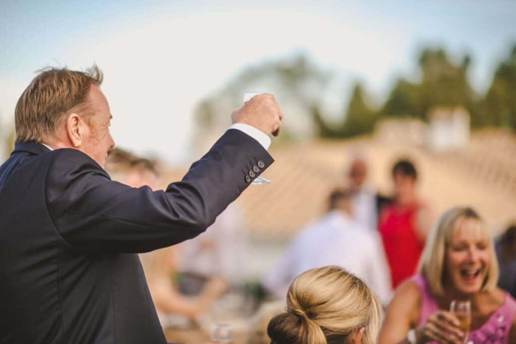 Father of the bride toasting the newlyweds.