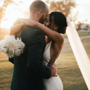 Bride and groom hugging after wedding speeches
