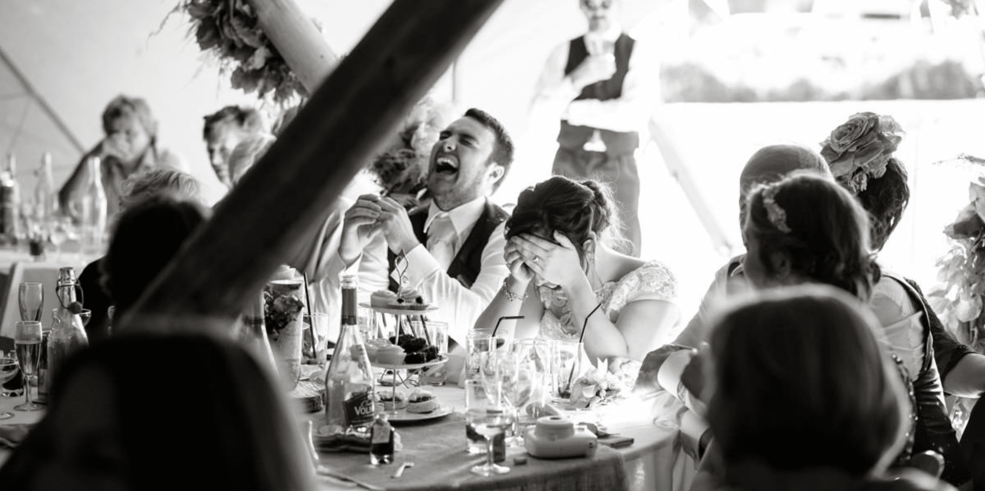 Audience laughing at best man speech