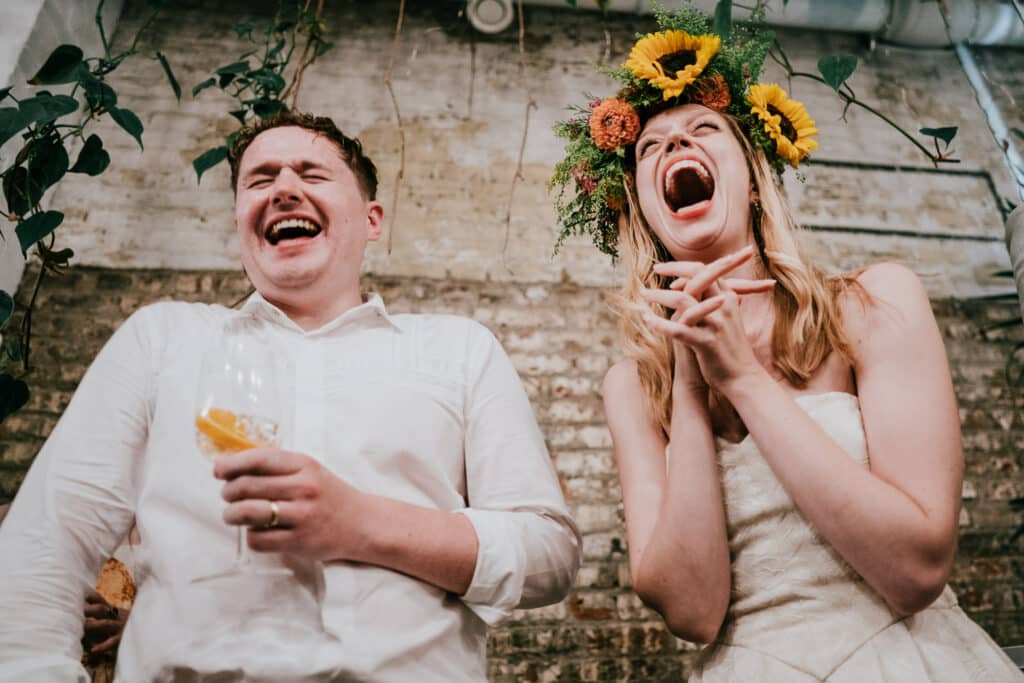A COUPLE listening to the brother of the bride speech