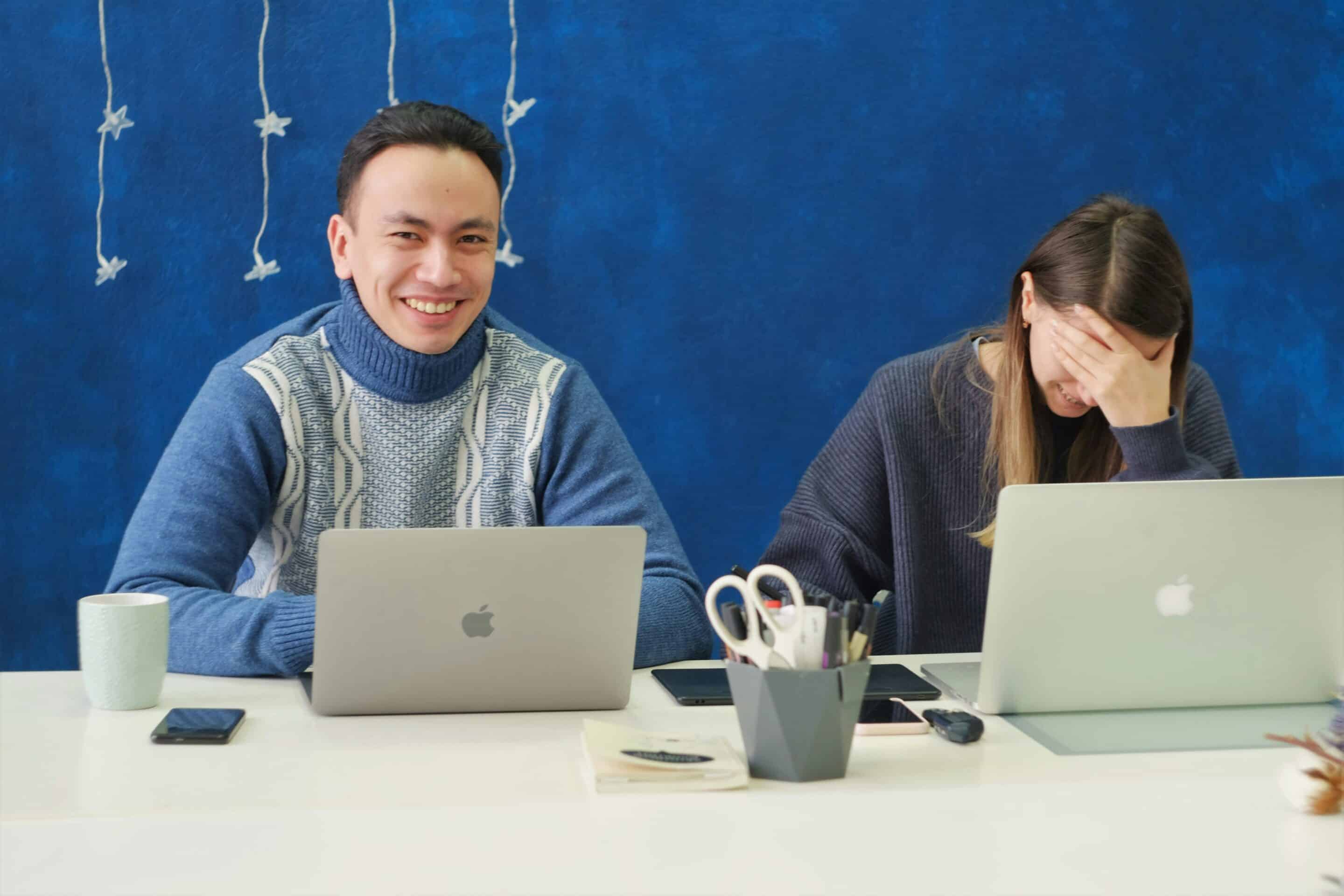 couple writing their wedding website together