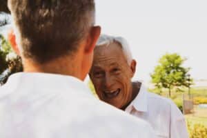 older man laughter anniversary speech