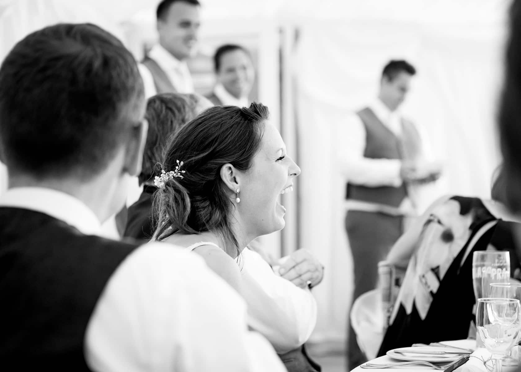 two wedding guests smiling