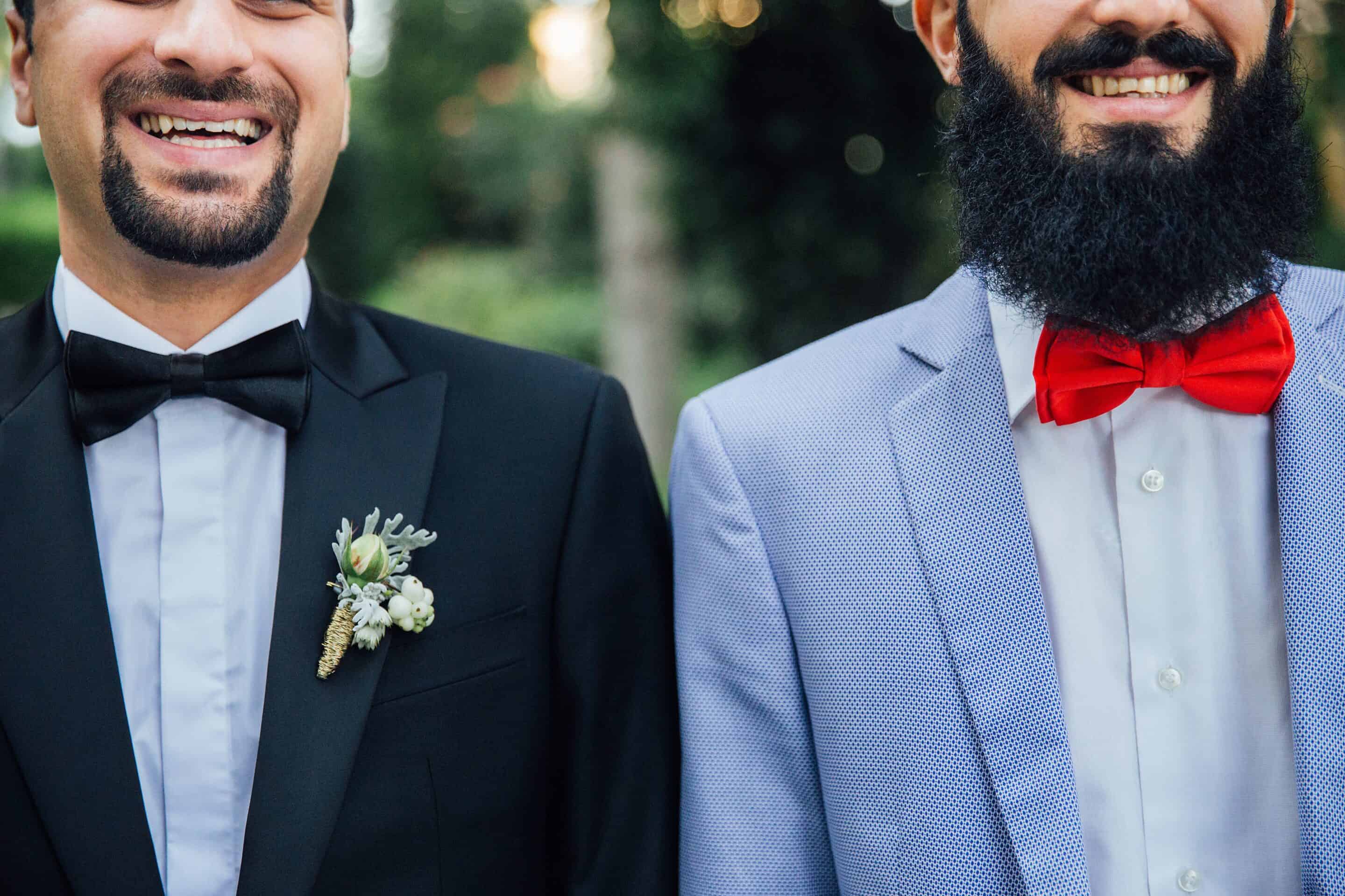 two wedding guests smiling