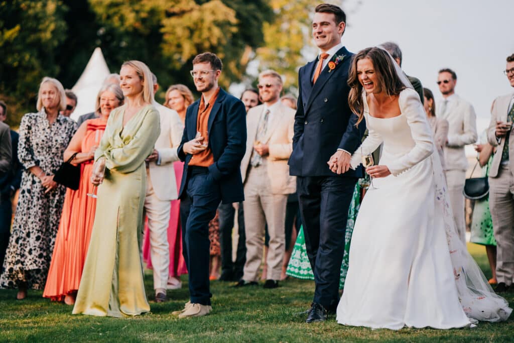 bride and groom listening to the best man