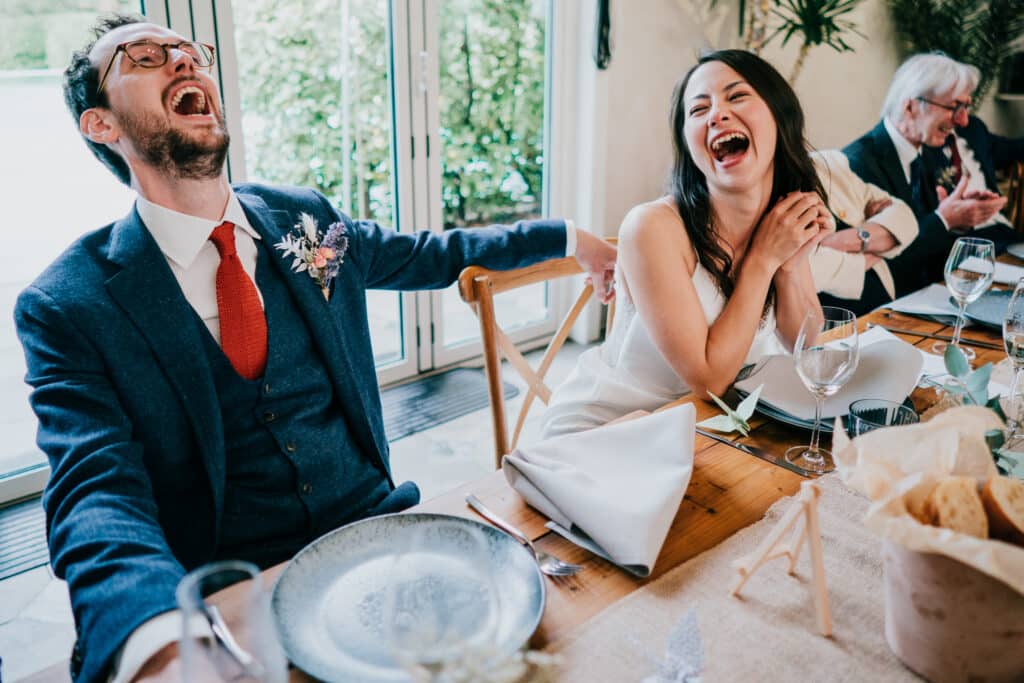 newlyweds laughing at speech written by AI Speech Generator