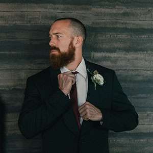 A groom delivering his wedding speech which was produced by an AI wedding speech generator.