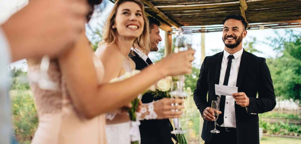 Best man speech with friends laughing