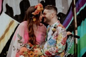 happy couple just after delivering their wedding vows Speechy